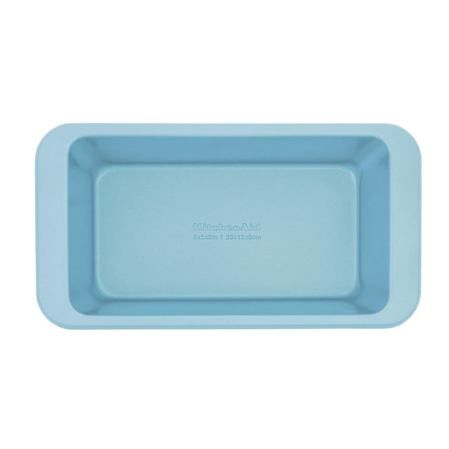 KitchenAid 9x5-inch Loaf Pan Mineral Water shown from above with a rectangular shape and smooth light blue nonstick aluminized steel surface, featuring embossed KitchenAid branding and size. Designed for even heat distribution and durability, suitable for baking bread and casseroles.