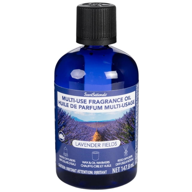 ScentSationals Multi Use Fragrance Oil Lavender Fields in a blue glass bottle with black ribbed cap, featuring a lavender field image and icons for water diffusers, wax and oil warmers, and reed diffusers, 147.8 ml air freshener refill ideal for home or office fragrance.