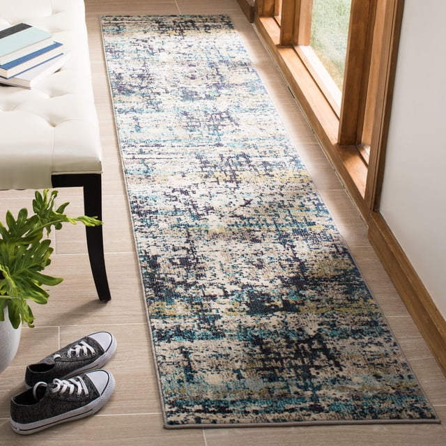 SAFAVIEH Madison Roswell Vintage Abstract Area Rug runner featuring a power-loomed durable yarn with a distressed abstract pattern in blue, beige, and dark tones, placed on a light wood floor near a window and white bench, ideal for hallways or entryways.