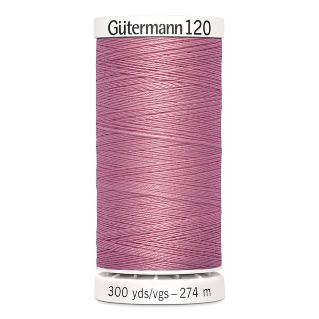 Gutermann 120 100% polyester all purpose thread spool in pink, tightly wound with label showing 300 yards (274 meters), suitable for machine and hand sewing various fabrics including cotton and synthetics, also ideal for craft and DIY projects.