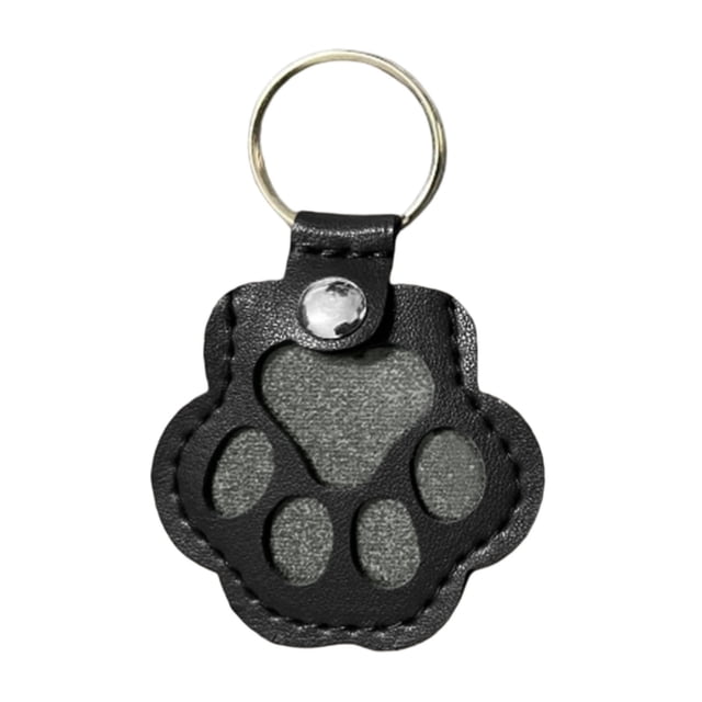 Wzzjkit Dog Storage Keychain featuring a cute leather paw-shaped design with a transparent center for holding pet hair keepsakes. The black leather material is soft and durable, with detailed stitching and a sturdy metal keyring. Ideal as a pet memorial gift or accessory for bags and purses.