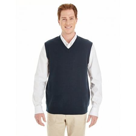 Harriton Men's Pilbloc™ V-Neck Sweater Vest, a men's sweater vest in a dark colour, crafted from 100% acrylic jersey knit with Pilbloc™ anti-pill performance. Features a 1x1 rib knit neckline, armholes, and bottom opening. Shown worn over a white dress shirt and beige trousers.