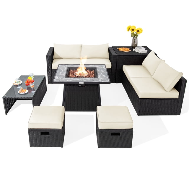 Patiojoy 9 Pieces Outdoor PE Rattan Wicker Sectional Sofa with 35-Inch Gas Fire Pit Table, featuring a black PE rattan frame with off-white cushions. The set includes a fire pit table with a marble-patterned ceramic top, a tempered glass coffee table, a storage box, two ottomans, two armless sofas, and two corner sofas. The fire pit table provides 50,000 BTU heat output and includes a simple ignition system. The furniture is arranged in a space-saving layout, suitable for outdoor gatherings. Accessories like a vase with flowers and serving trays are displayed on the tables.