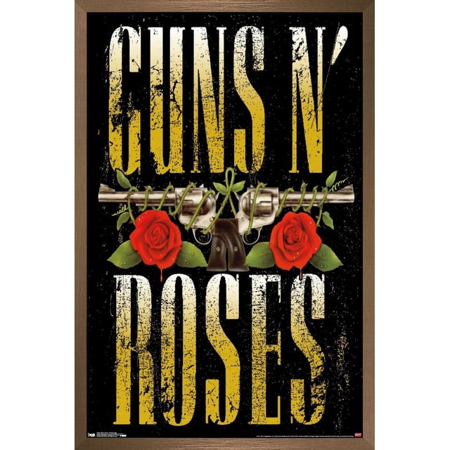 Guns N' Roses - Stacked Logo Wall Poster, 22.375" x 34" with distressed yellow text 'GUNS N' above and 'ROSES' below on black. Two silver revolvers crossed horizontally with green vines and two red roses with leaves appear between the text. Glossy poster print framed in brown wood, ideal for wall art and home décor.