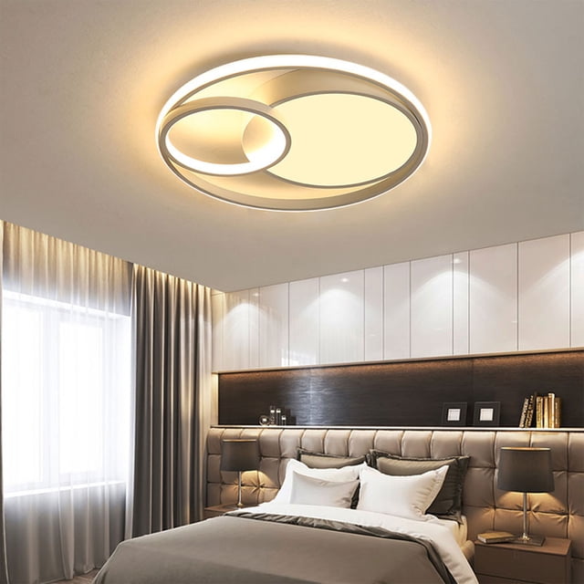 Wzzjkit Ceiling Lights for Bedroom Kitchen, a modern flush mount lighting fixture with a minimalist round design. It features adjustable LED lighting in cool white (6000K), natural light (4000K), and warm light (3000K), ideal for bedrooms, kitchens, and other indoor spaces. The durable aluminum alloy construction and frosted lampshade provide eye protection and long-lasting use. Shown installed in a stylish bedroom setting.