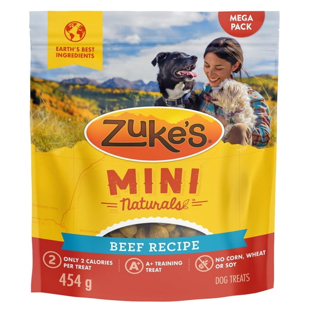 Zuke's Mini Naturals Bouchées Tendres Recette au Bœuf Gâteries pour Chiens dans une Pochette Refermable de 454 g avec Emballage Jaune et Rouge Mettant en Vedette Deux Chiens dans un Paysage de Montagne, Mettant en Valeur 2 calories par Gâterie, Sans Maïs, Blé Ou Soya, et Idéal comme Gâterie d'Entraînement A+.