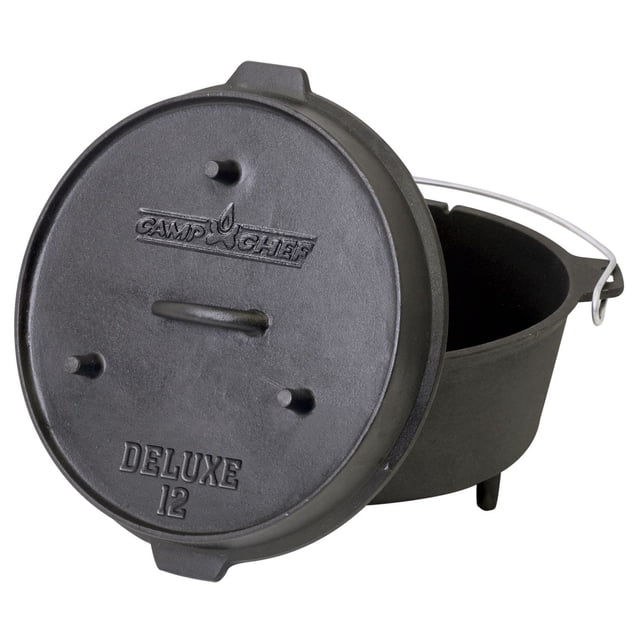 Camp Chef Deluxe 12" Dutch Oven made of seasoned cast iron with a 12-inch diameter base and a lid that doubles as a skillet with three legs and a loop handle, embossed with Camp Chef logo and Deluxe 12 text, ideal for slow roasting and outdoor cooking.