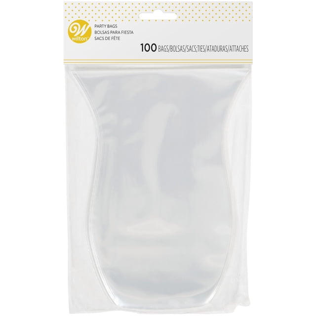 Wilton Clear Shaped Treat Bags package containing 100 clear plastic party favour bags with a curved shape, sealed in transparent packaging with a white and gold polka dot header card featuring the Wilton logo and product details, suitable for wrapping small treats and gifts.