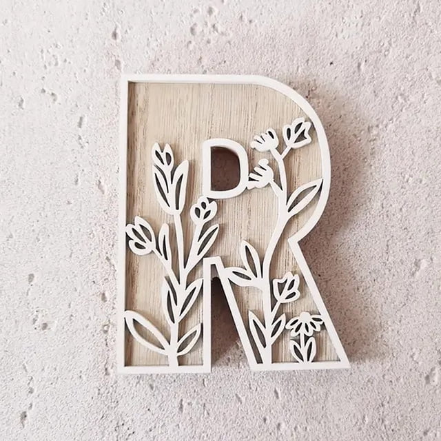 5 Inch Wooden Letter 'R' for wall decoration, crafted from durable wood with a natural finish and white floral cutouts. Perfect for creating name signs, decorating rooms, weddings, or home projects. Lightweight and customizable for painting or personalizing craft projects.