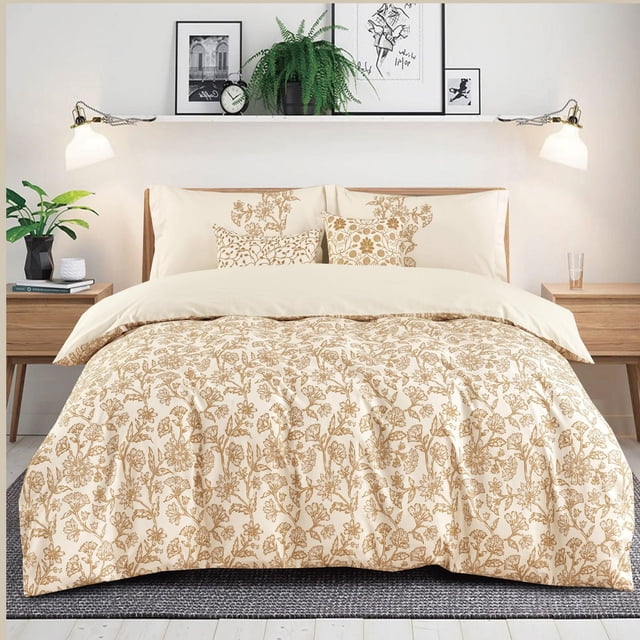 Johnson Home 5-Piece Comforter Set with queen comforter in beige and light brown floral pattern, two matching shams, and two decorative cushions on a bed with wooden nightstands, plants, and minimalist wall art, made from 200TC cotton for year-round comfort.