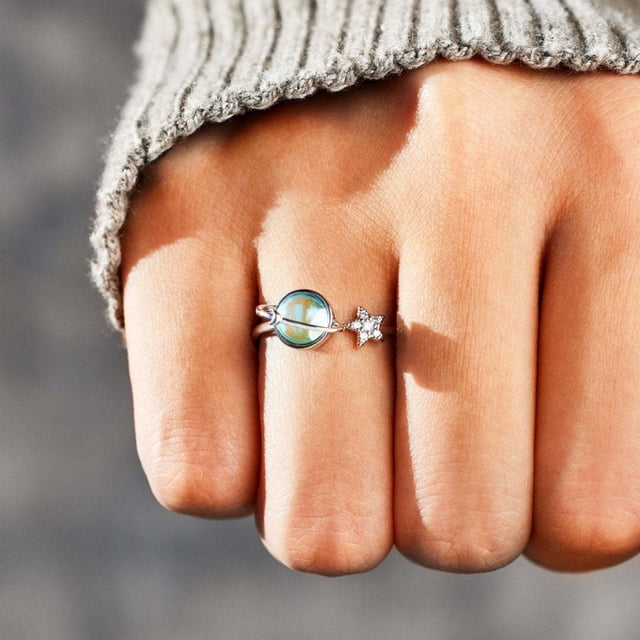 TopLLC Rings Rotating Rings For Women Fidget Finger Anxiety Ring Wheel Lady Bands Relieving Stress displayed on a hand with a grey knit sleeve. This women's ring combines a rotating design for stress relief and fidgeting with a stylish look for everyday wear.