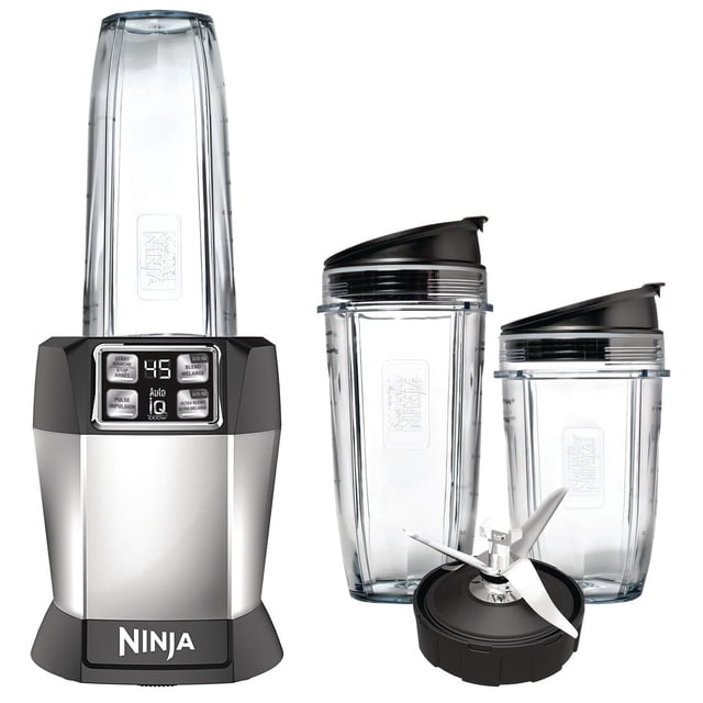 Nutri Ninja Auto iQ blender with a silver and black 1000-watt base featuring a digital countdown timer and Auto-iQ one-touch programs, three clear BPA-free Tritan cups in 18 oz, 24 oz, and 32 oz sizes with black spout lids, and a Pro Extractor Blades assembly for nutrient extraction and crushing ice.