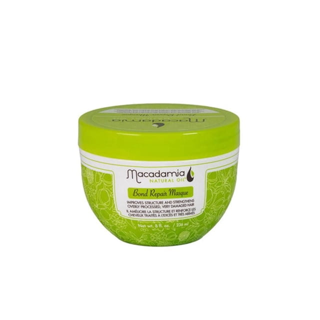 Bond Repair Masque by Macadamia Natural Oil, a 236 ml green round jar with a matching lid and white label featuring green floral designs, formulated to strengthen and improve the structure of dry, damaged, and chemically treated hair, ideal for deep conditioning treatments.