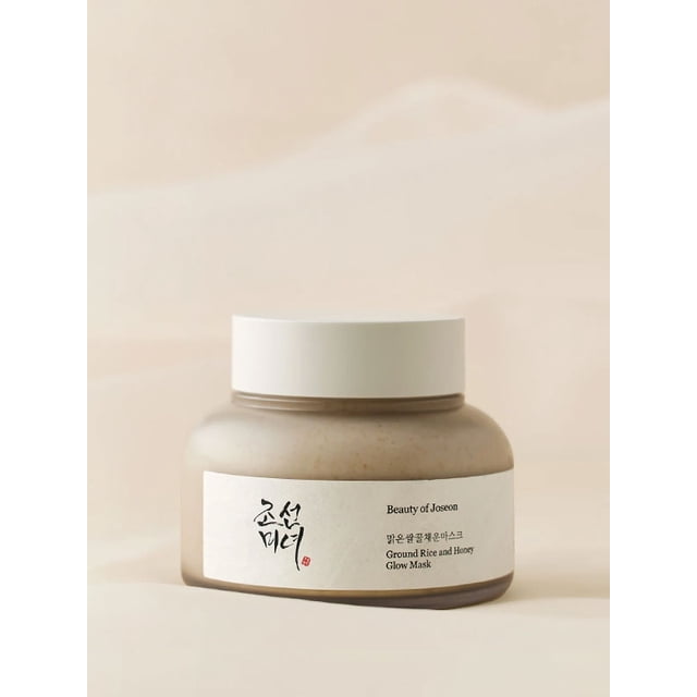 Beauty of Joseon Ground Rice and Honey Glow Mask 150ml in a beige jar with a white lid, featuring a minimalist label with Korean text and the product name. The jar is set against a soft, neutral background, emphasizing its traditional Korean skincare inspiration.