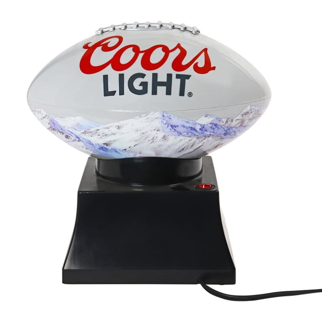 Coors Light Hot Air Popcorn Maker and Football Serving Bowl shaped like a white football with red Coors Light logo and blue snowy mountain graphics, mounted on a black base with a red power button and power cord, designed for countertop use and game day snacks.