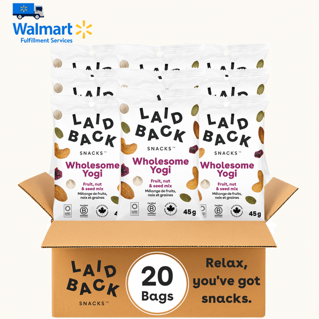 Laid Back Snacks Wholesome Yogi mix featuring dried cranberries, yogurt chips, roasted cashews, almonds, and pumpkin seeds, packaged in 20 individual 45 g bags. The image shows the snack bags arranged in an open cardboard box with the Laid Back Snacks logo and text reading 'Relax, you've got snacks.'