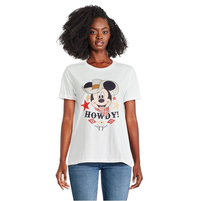 Disney Women's Minnie Mouse Tee in white 100% cotton jersey knit featuring a front graphic of Mickey Mouse wearing a cowboy hat and bandana with the word 'Howdy!' below, short sleeves, crew neckline, and straight hem, suitable for casual outfits with jeans or leggings.