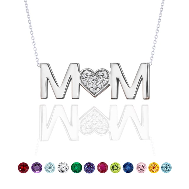 JeenMata MOM Pendant Necklace featuring a heart-shaped centerpiece adorned with round-cut moissanite stones, set in 18K white gold over silver. The pendant spells 'MOM' with the heart replacing the 'O,' representing the April birthstone, suspended on an 18-inch white chain. Perfect for Mother's Day gifting.