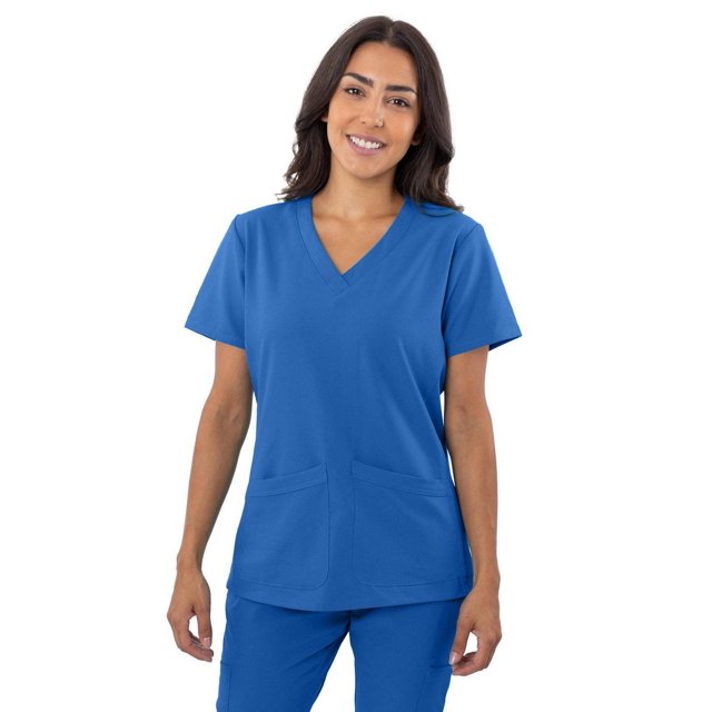 Greentown Canada Scrubs 4Flex Scrub Top (1201) in blue, front view on a model wearing matching scrub pants. Features a contemporary fit, V-neck, two patch pockets, and 4-way stretch moisture-wicking fabric made of 93% polyester and 7% spandex, designed for medical workwear comfort.