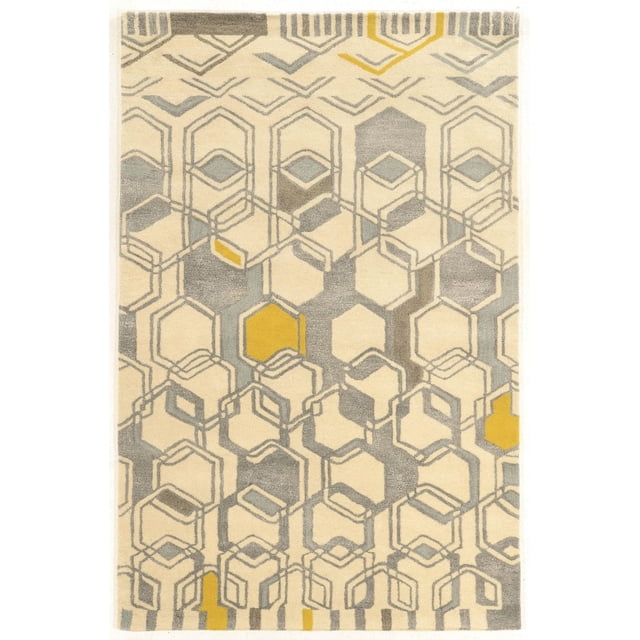 Aspire Wool Geo Ivory & Grey 8' x 11' Area Rug with a hand-tufted wool pile, ivory background, and geometric honeycomb pattern in light grey, pale blue, and mustard yellow accents, suitable for adding warmth and defining spaces in larger rooms or open layouts.