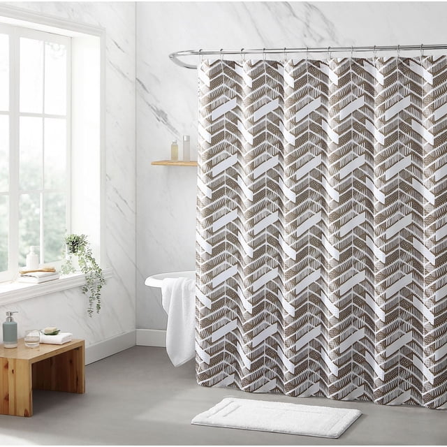 1pc Chevron Fabric Shower Curtain with brown and white chevron pattern made of 125GSM polyester poly jacquard fabric, waterproof and wrinkle-resistant, hanging on a curved metal rod in a bright bathroom with marble walls, wooden bench, and white bath mat.