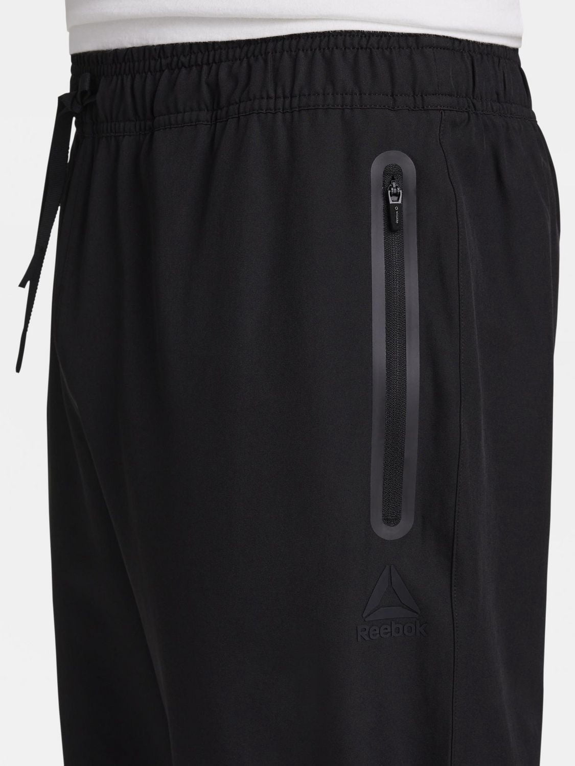 Reebok Pantalon fuselé tissé urbain pour homme