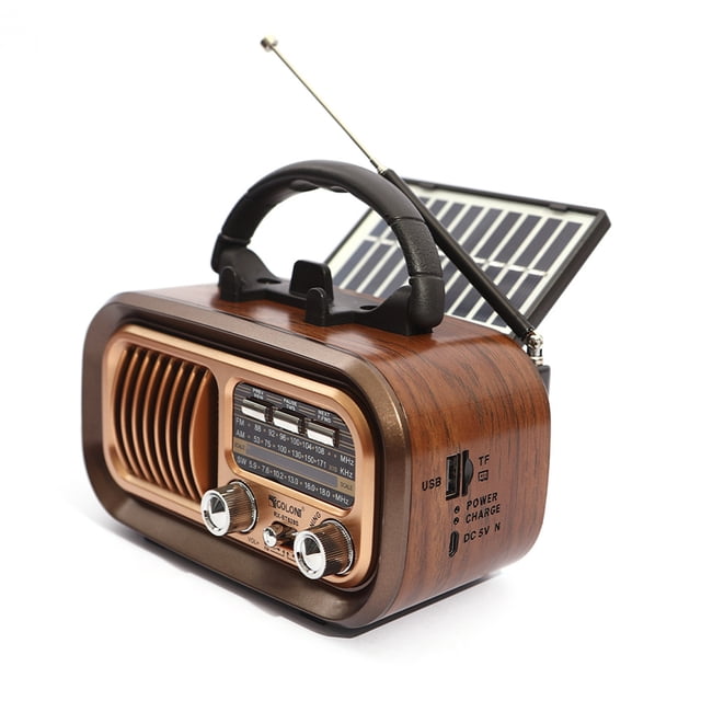 RX-628BTS Radio AM FM Alimentée par Câble USB Ou Panneaux Solaires, Présentant un design Rétro avec une Coque en Plastique à Texture Bois, une Antenne Rétractable et des sources d'Alimentation Doubles. Cette Radio portable Comprend un Grand Bouton de Réglage Analogique, des Fentes pour Cartes USB et TF, et un Panneau Solaire pour la Recharge. Idéale pour la Maison, l'Extérieur Ou les Urgences.