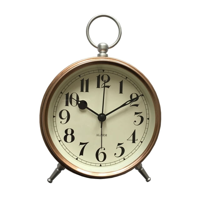 HOMETRENDS Copper Pocketwatch Tabletop Alarm Clock with copper-plated metal frame, silver-finished top ring and feet, cream dial with black serif Arabic numerals, black hour and minute hands, glass lens, quartz movement, and alarm with snooze, suitable for bedside use.