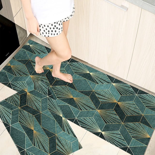EGNMCR Kitchen Mat 2pcs Kitchen Rugs Cushioned Kitchen Mats for Floor with a geometric multicolor design in green and gold. These washable and waterproof mats are placed on a tiled kitchen floor near a wooden cabinet, highlighting their non-slip backing and cushioned surface for ergonomic support. Ideal for kitchens, offices, and other indoor spaces.