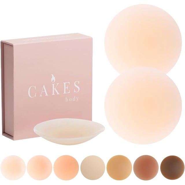Cakes Grippy Seamless Covers, reusable and washable silicone nipple covers designed for full coverage and comfort. The image shows a pair of round, non-adhesive silicone covers in a light skin tone, alongside a compact pink box labeled 'Cakes body.' These seamless covers are waterproof, invisible under clothing, and suitable for activities like workouts, lounging, and swimming. Multiple skin tone options are displayed at the bottom for versatility.