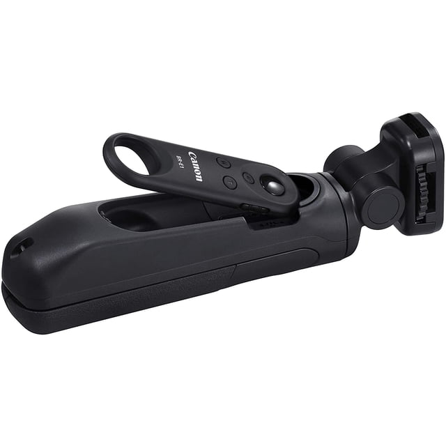 Canon Tripod Grip HG-100TBR, 4157C001, displayed in a folded position with its sleek black design. The Wireless Remote Control BR-E1 is securely placed in the grip’s slot. This tripod grip provides a stable base for compatible EOS M and PowerShot G series cameras, ensuring clear, shake-free images and videos. Its adjustable head allows for versatile shooting angles, and its lightweight, compact design makes it easy to carry.