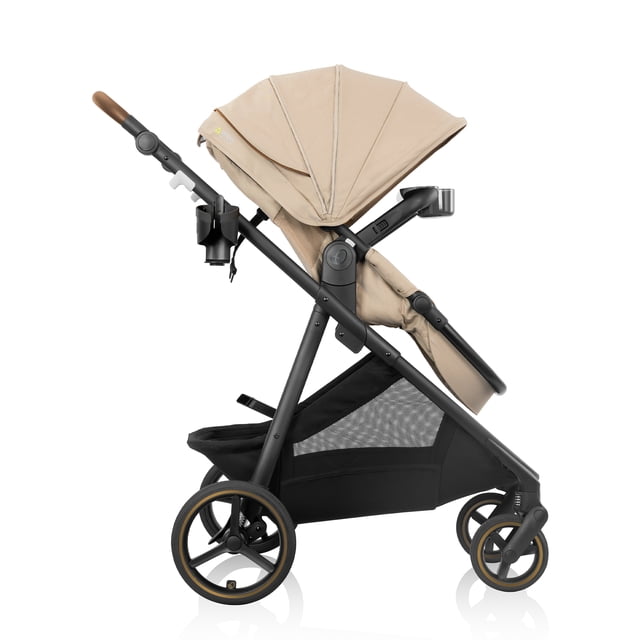 Evenflo Shyft Intuiti+ Stroller with beige Green & Gentle fabric, side profile showing modular frame in parent-facing toddler seat mode, expandable UPF 50+ canopy, all-wheel suspension with premium rubber tires, adjustable leatherette handle, large mesh storage basket, linked rear brakes, BPA-free child tray, and parent cup holder.