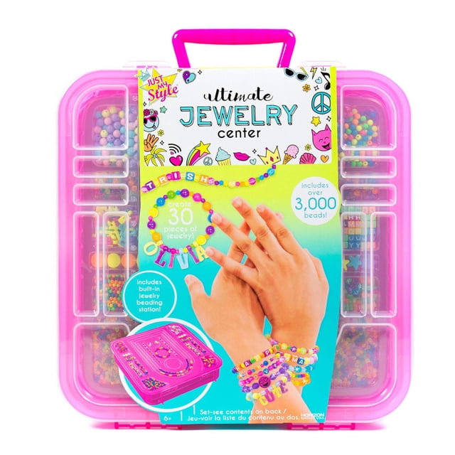 Just My Style® Ultimate Jewelry Center in a pink plastic storage case with built-in beading station and compartments holding over 3,000 colorful beads including alphabet and accent beads, shown with hands wearing personalized beaded bracelets and a name necklace, suitable for creating 30 unique jewelry pieces and creative craft projects for ages 6 and up.