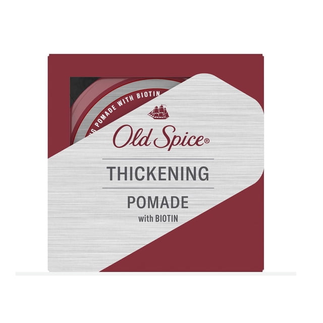Old Spice Thickening Men's Pomade with Biotin in a red and silver box featuring a round red container inside, designed to create thicker-looking hair with a low-shine finish and low-medium hold, often used for daily hair styling.