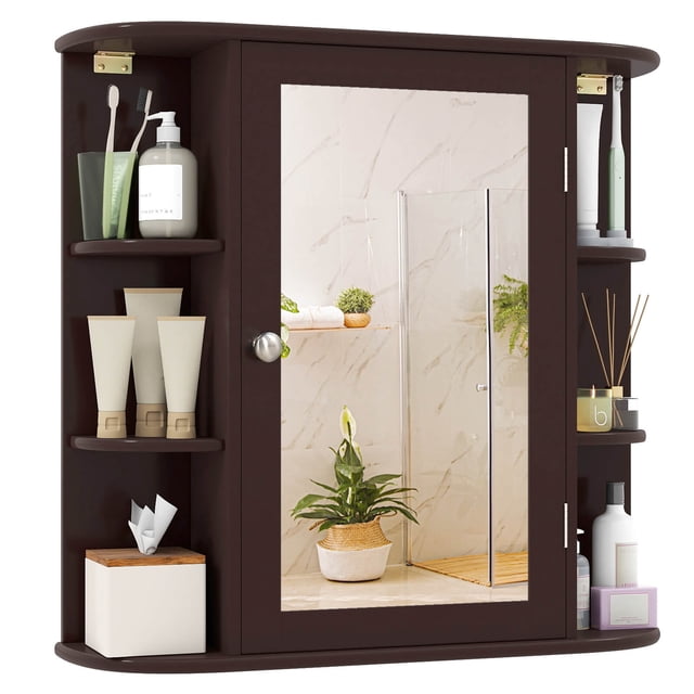 Costway Multipurpose Mount Wall Surface Bathroom Storage Cabinet Mirror Brown made of durable MDF with a waterproof finish. The cabinet features a mirrored door for grooming, 4 internal shelves for hidden storage, and 6 open side shelves for frequently used items. Its wall-mounted design maximizes space, and the rounded corners enhance safety. Dimensions are 26 inches by 6.5 inches by 25 inches (L x W x H).