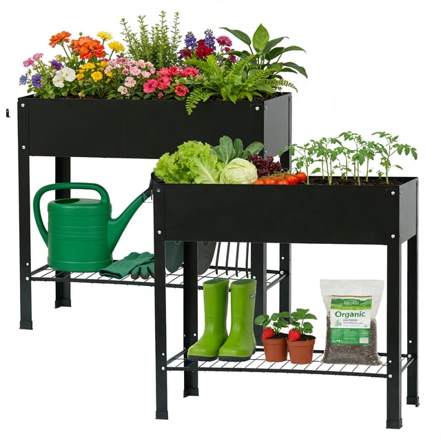 Noble House 2PCS Raised Garden Bed with Legs in black rust-resistant metal, featuring two elevated planting boxes; one with mixed flowers and herbs, the other with lettuce, cabbage, tomatoes, and seedlings. Each bed includes a lower shelf with gardening tools, green watering can, gloves, boots, potted strawberry plants, and organic soil bag, ideal for ergonomic gardening with drainage holes to prevent waterlogging.