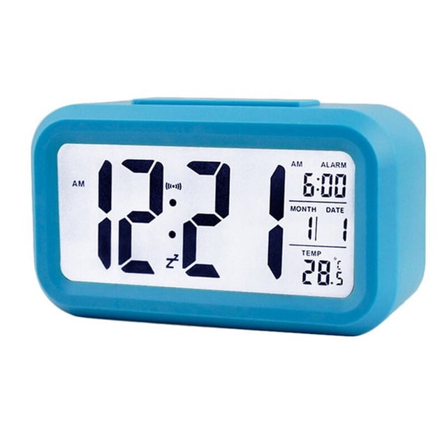 Smart Digital Alarm Clock with Date and Temperature Snooze Button on Top Battery Operated Rectangle Desk Clock with Night Light for Bedroom Kids Children Girls Boys. The clock features a large LCD display showing time in 12/24-hour format, date, and temperature in Celsius or Fahrenheit. It has a blue rectangular design with a matte finish and a snooze button on top. The ambient light sensor adjusts brightness automatically, and the backlight activates in low light. Dimensions are 13.5 x 7.5 x 4.5 cm. Batteries not included.