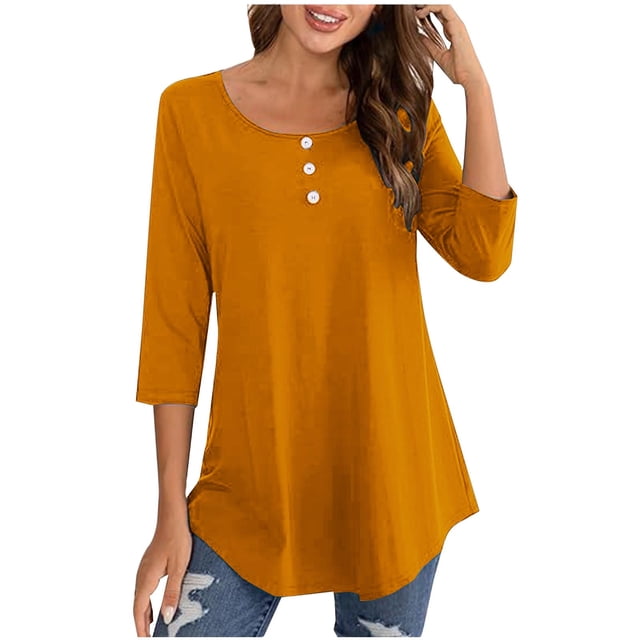 FAIWAD Oversized Tshirts for Women with 3/4 sleeves, button decor, and a round neck. The mustard yellow top has a relaxed fit and is styled with distressed denim jeans, suitable for casual outings or business wear.