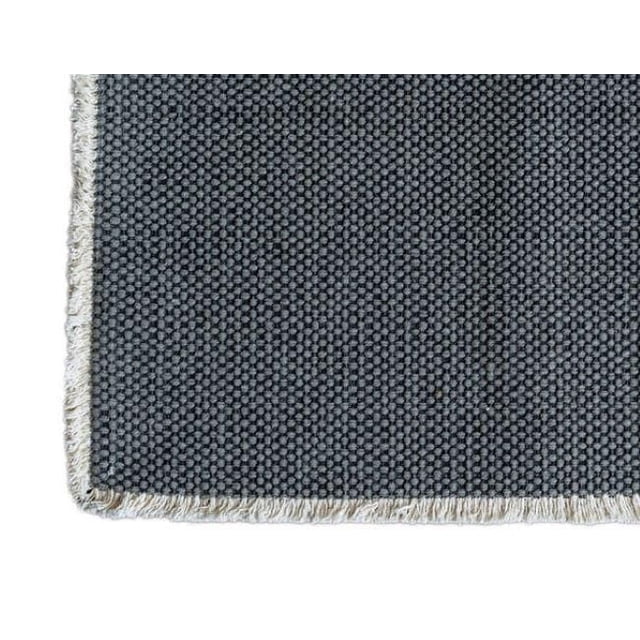 Fabstyles 100% Cotton Bali Table Runner, 14 x 72 inches, with dark grey woven texture and white fringed edges, machine washable and suitable for indoor and outdoor dining tables.