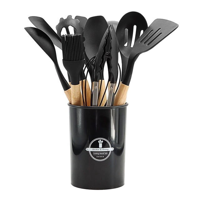 Cooking Non-stick Pan Storage Bucket Wooden Handle Silicone Kitchenware 12-piece Silicone Kitchenware Set. The set includes 12 black silicone kitchen utensils with wooden handles, such as a slotted spatula, tongs, and a whisk, neatly arranged in a black storage bucket. Designed to withstand high temperatures up to 450°F, these BPA-free utensils are safe for non-stick cookware and easy to clean. The wooden handles provide a comfortable grip and prevent heat transfer.