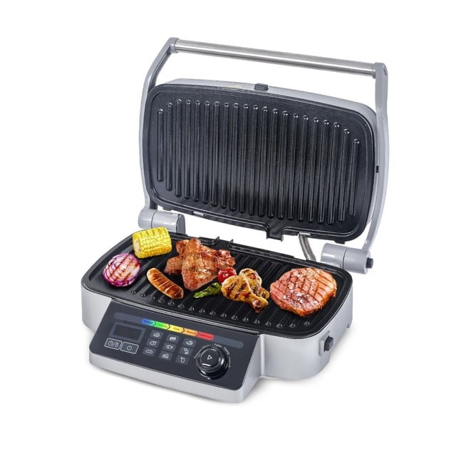 COMMERCIAL CHEF Gril de Contact 9-en-1 avec Couvercle à Charnière Ouverte Montrant des Plaques de Cuisson en Aluminium Moulé sous Pression pour Cuire du Maïs en Épi, Oignon Rouge, Saucisse, Ailes de Poulet, Poivre et steak, avec Panneau de Commande Numérique et Neuf options de Cuisson Préréglées sur un Gril Intérieur Électrique Argent et Noir.