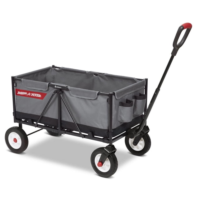 Radio Flyer The Beast EZ Fold Maximum Capacity Heavy-Duty Kid & Cargo Wagon in grey with collapsible frame, off-road puncture-proof tires, padded seats, side storage pockets, two front cup holders, and a rubber grip pull handle that stays upright, designed to haul up to 300 lbs of kids or cargo, suitable for outdoor use and carrying sports or camping equipment.
