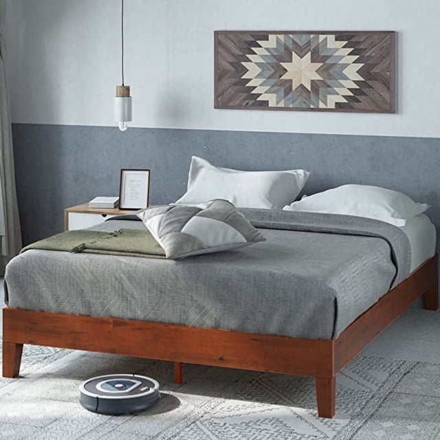 Beyond Lifestyle Upholstered Platform Bed Frame with Adjustable Tufted Headboard in dark gray, queen size. The minimalist design features a slim and sturdy frame with no box spring needed, serving as a reliable mattress foundation. The bed is displayed in a modern bedroom with neutral decor, including geometric wall art above.