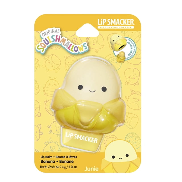 Squishmallows Lip Smacker Balm banana flavor featuring a soft, squishy yellow banana character with a smiling face and peeled banana design, on yellow packaging with Lip Smacker and Squishmallows logos, suitable for moisturizing and hydrating lips.