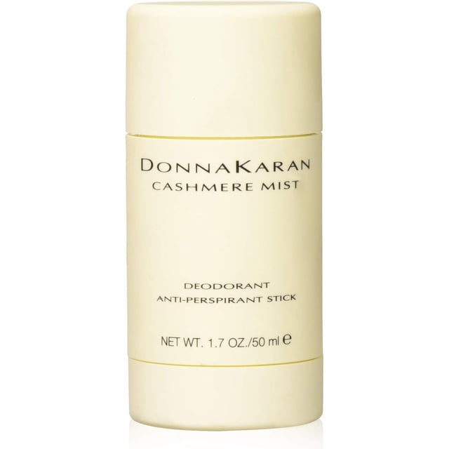 Donna Karan Cashmere Mist Deodorant Stick, 1.7 ounce, displayed in a cream-colored cylindrical container with black text highlighting the product name and details. This women's deodorant stick offers all-day odor protection and features the Cashmere Mist fragrance with notes of Moroccan jasmine, sandalwood, and amber, suitable for all skin types.