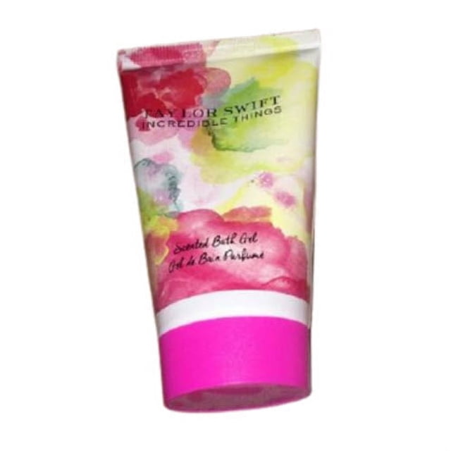 Taylor Swift Incredible Things Scented Bath Gel for Her in a 50ml (1.1oz) travel-size tube. The packaging features a vibrant watercolor floral design with pink, yellow, and green hues, and a bold pink cap. Ideal for personal care and travel.