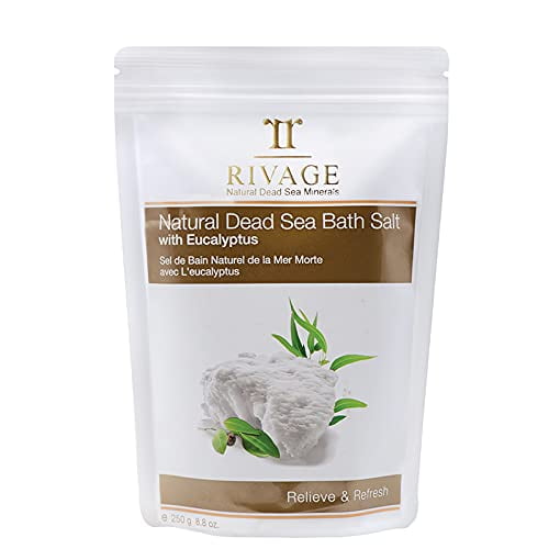 RIVAGE NATURAL DEAD SEA MINERALS Bath Salt with EUCALYPTUS 250g in a resealable white pouch featuring the brand logo and product name. The packaging highlights its natural minerals, therapeutic-grade Dead Sea salt, and eucalyptus infusion for relaxation and skin relief. Suitable for spa treatments and external use only.