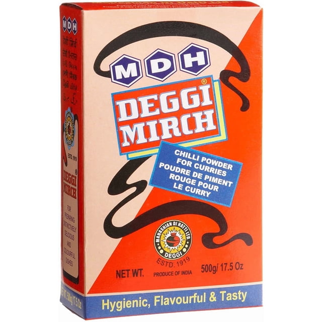 MDH Deggi Mirch chili powder box with red and beige packaging, bold white and red text, black chili graphic, and bilingual blue label for curries, 500g (17.5 oz), produced in India, a mild-hot blend that adds natural red color and flavor to curries, also suitable for enhancing sauces and marinades.