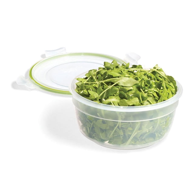 Starfrit LocknLock Easy Match Plastic Container - 47oz/1.4L, clear round plastic food storage container with a white lid featuring a green airtight silicone seal and four locking tabs, shown open and filled with fresh green arugula leaves, ideal for meal prep and keeping food fresh and organized.