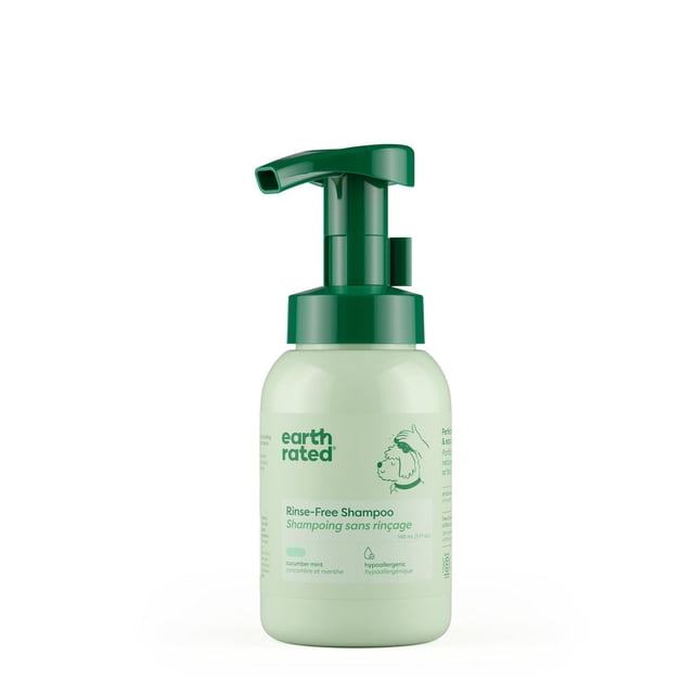 Earth Rated Rinse-Free Dog Shampoo in a light green 148 ml pump bottle with dark green dispenser, waterless formula for quick spot-cleaning and odor neutralizing, infused with cucumber mint scent and hypoallergenic ingredients suitable for all coat types.